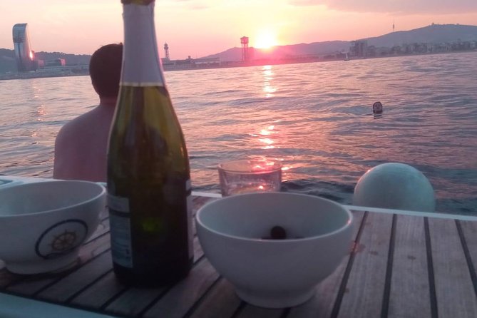 1h Refreshing Sailing Tour in Barcelona with Open Bar & Snacks - Getting comfortable fast: cushions, restroom, and the boat vibe