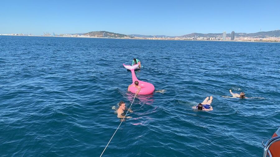 Barcelona: 2-Hour Sailboat Tour with Paddle Boarding - Languages and guide style, what it feels like in real life