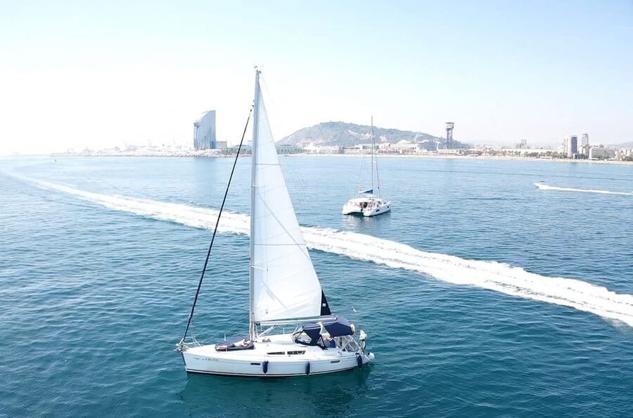 Barcelona: Boat trip with cava in amazing sailboat - Badalona beach stop and the chance to swim in clear water