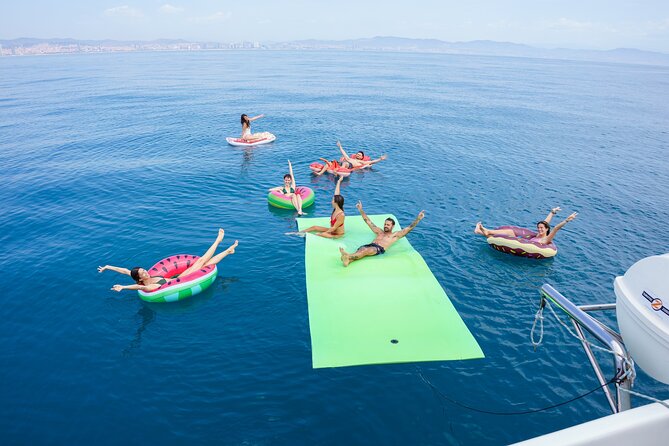 Barcelona Catamaran Cruise with Tapa & Drink Included - Sailing the coast for landmark views, with Montjuic and Sagrada Familia in sight