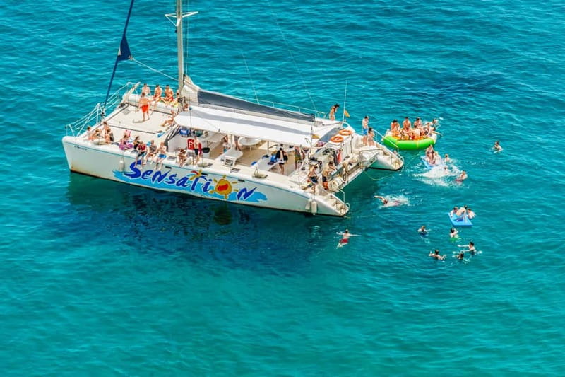 Barcelona: Catamaran Party Cruise with BBQ Meal - Cruise Along The Coast Toward Badalona, Then Drop Anchor To Swim