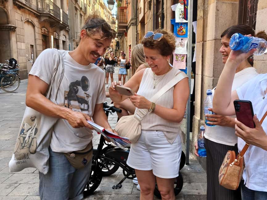 Barcelona: City Highlights Bike Tour with Locals - Getting set up at Plaça Reial, next to Las Ramblas