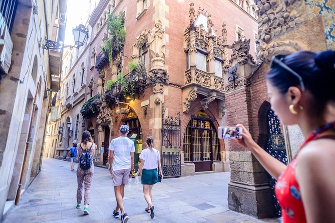 Barcelona E-Bike Small Group Tour with Tapas & Wine Tasting - Riding toward the coast: Port Olímpic, Barceloneta, and Port Vell promenade views