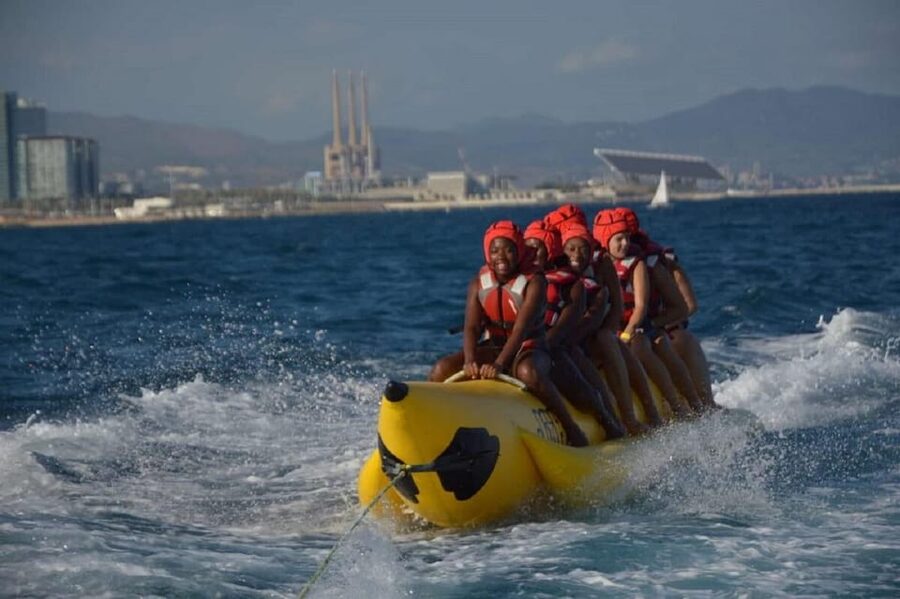 Barcelona: Inflatable Banana Boat Ride - Riding details: holding on, waves, and the fun part of getting thrown around