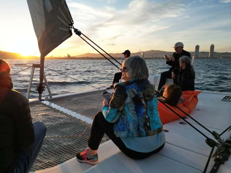 Barcelona: Luxury Catamaran Sunset Cruise - Comfort details at sunset: blankets, music, WiFi, and the smoking area