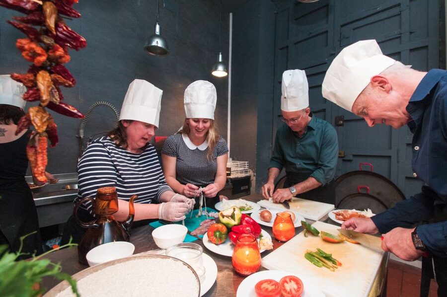 Barcelona: Paella Cooking Experience & Boqueria Market Tour - Inside the Workshop Kitchen: Your Role at the Paellera