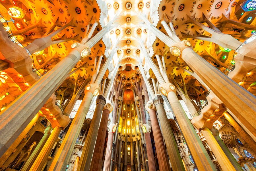 Barcelona: Sagrada Familia Priority Access Guided Tour - Inside the basilica: stained glass, the nave, and the plan you can actually follow