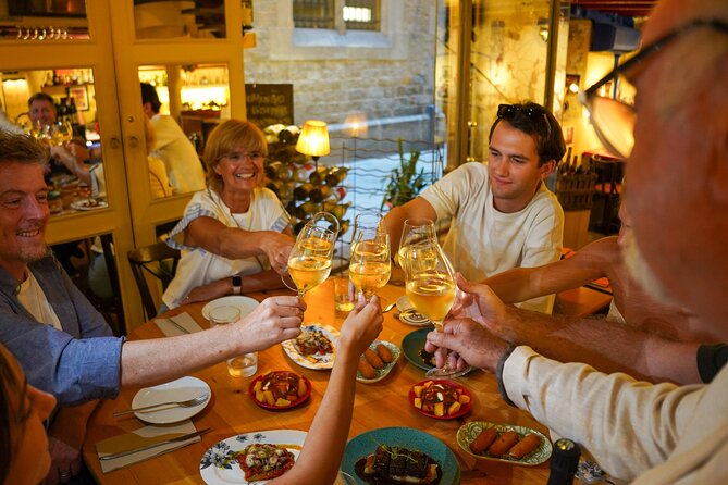 Barcelona Tapas and Wine Experience Small-Group Walking Tour - Four restaurant stops that add up to a real meal