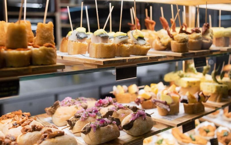 Barcelona: The Ultimate Local Tapas & Drinks Food Tour - Fresh Hits and Salty Cuts: Pimientos de Padrón, Tomato Salad, Charcuterie
