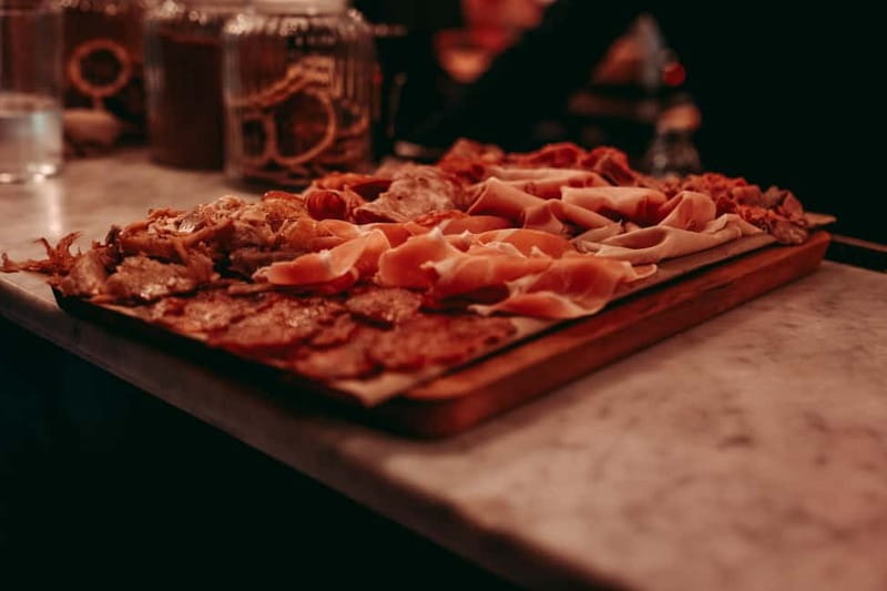 Barcelona: Tipsy Tapas & History Tour in the Gothic Quarter - The second and third tastings: croquettes, bravas, seafood, and cheese boards