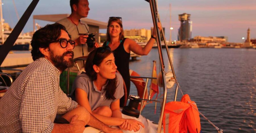 Barcelona: Unique Sunset Sailing Tour with Tapas & Open Bar - Sailing vibe: steering the boat, then letting it go