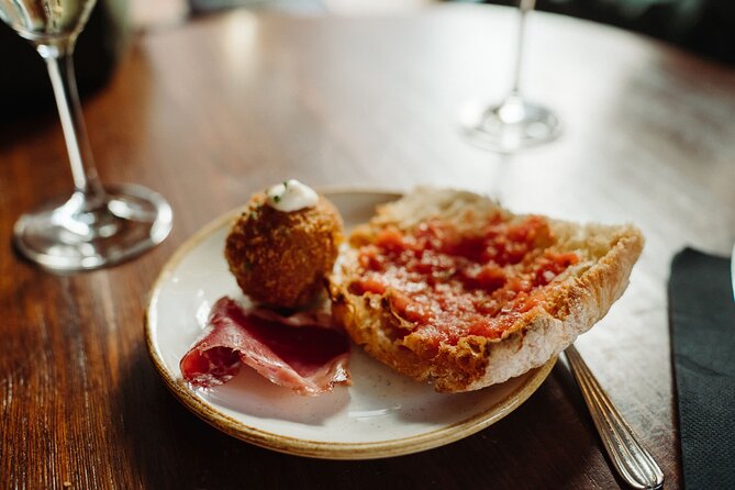 Bohemian Barcelona Neighborhood Evening Tapas & Wine Tour - Why El Born at night makes tapas feel like a plan, not a gamble