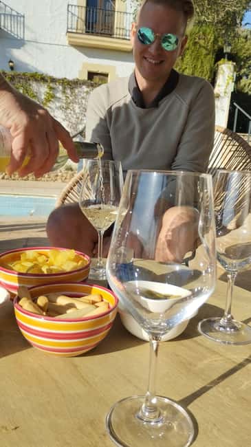 From Sitges: Wine Tasting at 2 Wineries, Snacks and Pickup - How much you will taste, snacks, and the bottle-shopping moment