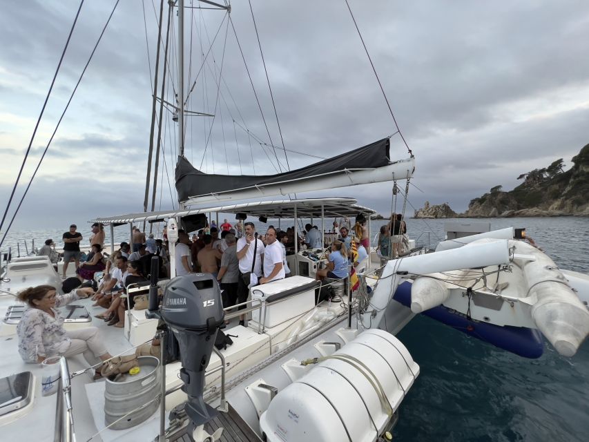 Lloret de Mar: Sunset Catamaran Cruise with DJ and Drinks - Sailing Along Costa Brava at Golden Hour