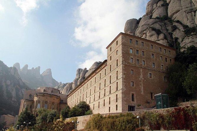 Montserrat Day Trip Private or Small Group with Basilica Tickets - La Moreneta inside the basilica: the moment people remember