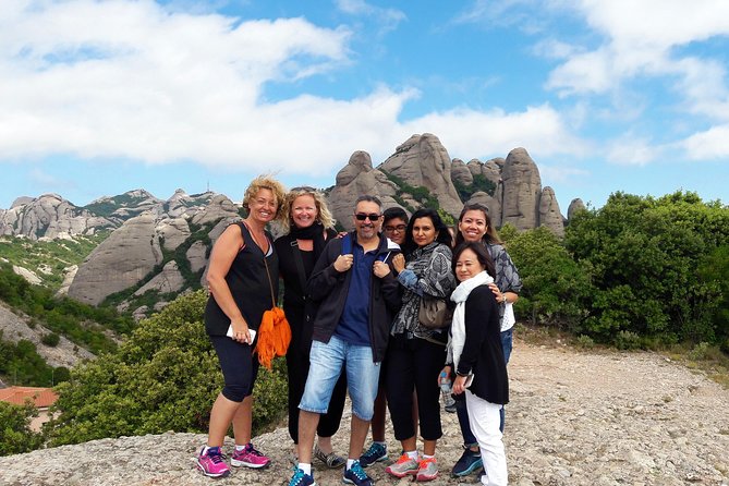 Montserrat Half Day with Cable Car and Easy Hike from Barcelona - Abadia de Montserrat: basilica, atrium, and the feeling of a living sacred site