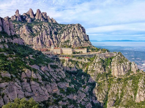 Panoramic Barcelona and Montserrat with Cog-Wheel Train - Montjuïc cable car and viewpoints: Olympic-era views with old-city history