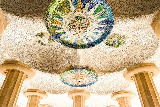 Park Guell and Sagrada Familia Tour with Skip the Line Tickets - Sagrada Familia inside: three facades, stained glass light, and columns