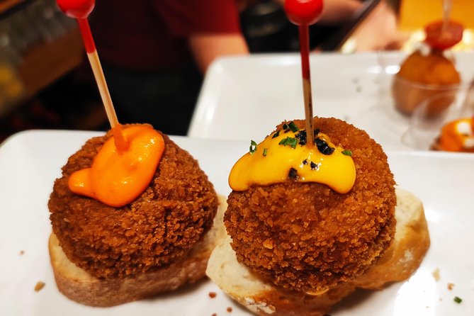 Spanish Wine and Tapas Tour in a Local Neighborhood in Barcelona - Wine and non-alcoholic drinks: how the tour handles preferences