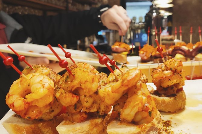 Spanish Wine and Tapas Tour in a Local Neighborhood in Barcelona - Meeting point at Avinguda del Paral·lel, 115, and how the evening starts